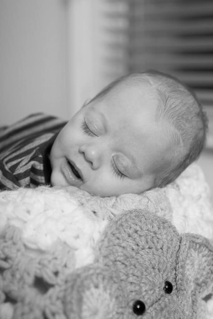 Newborn baby sleeping - black and white photography